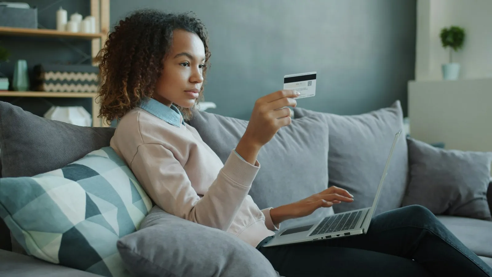 Customer shopping online on a laptop at home